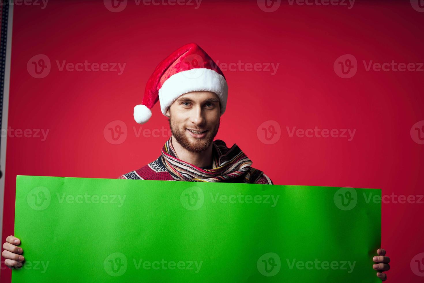 emotional man in New Year's clothes advertising copy space red background photo