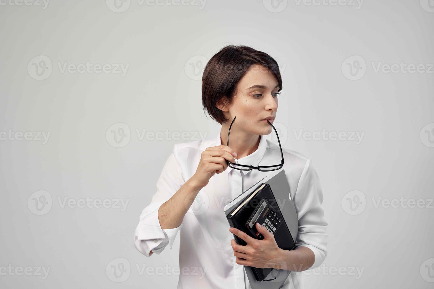 Businesswoman with glasses self-confidence light background photo