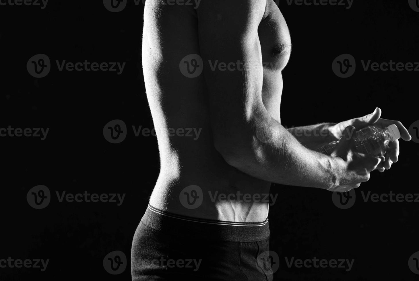 a man in black panties an inflated body black and white photo fitness