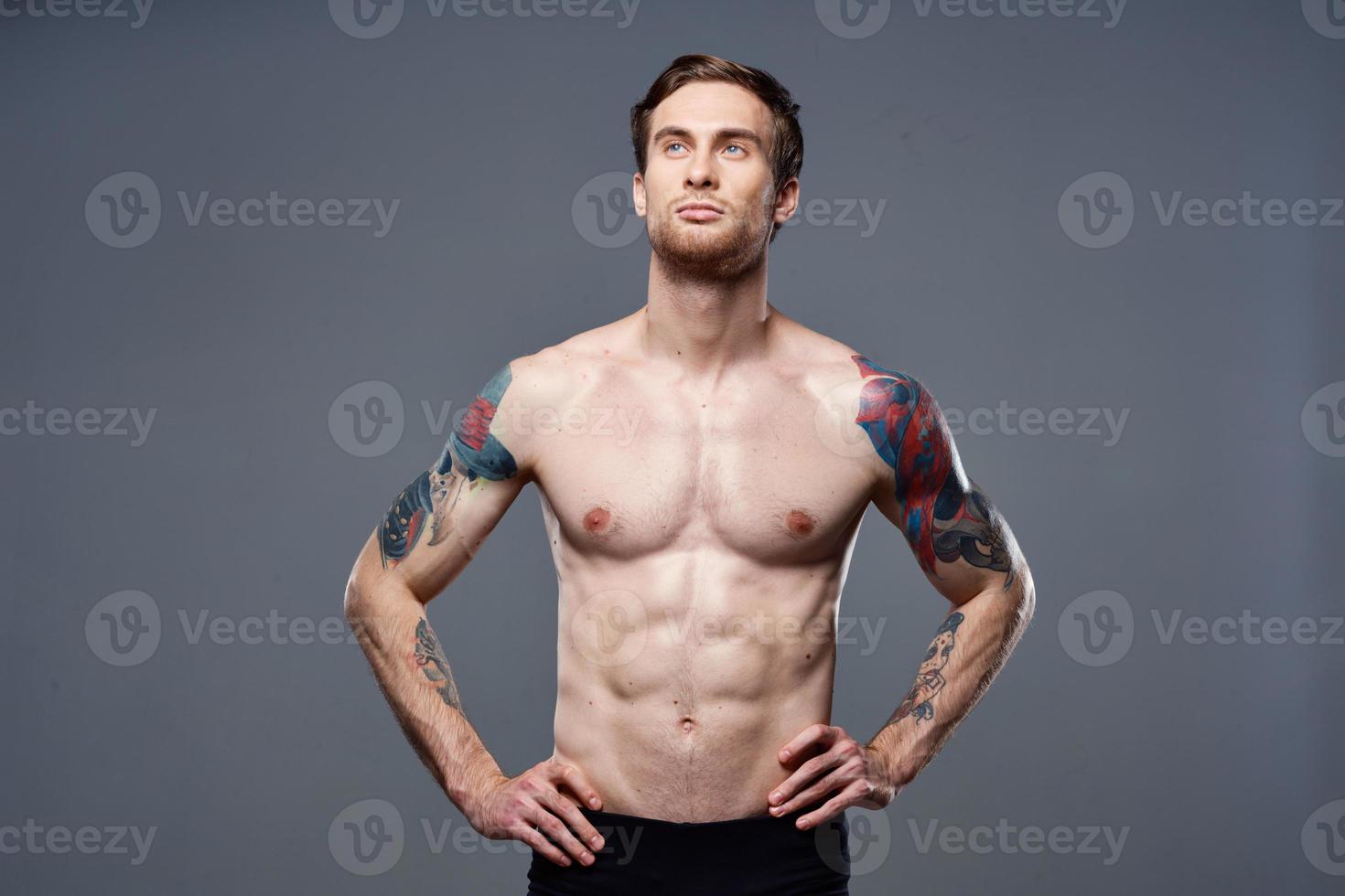 male topless muscled abs tattoo cropped workout view photo