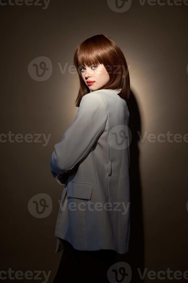 Charming girl in evening wear gesticulate with hands photo