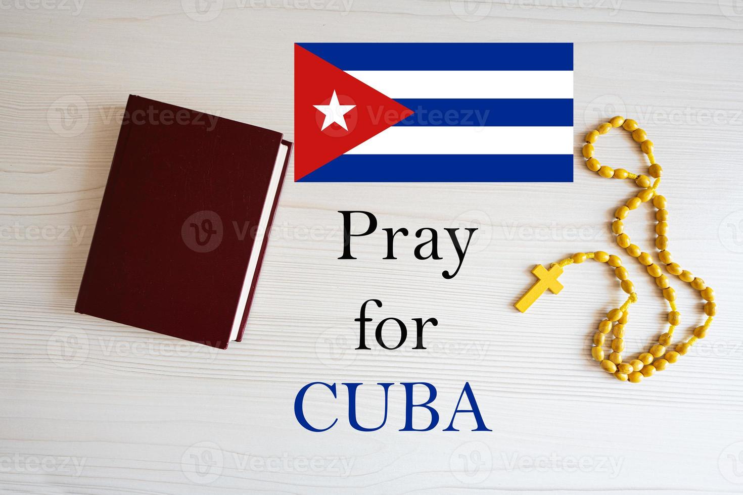 Pray for Cuba. Rosary and Holy Bible background. photo