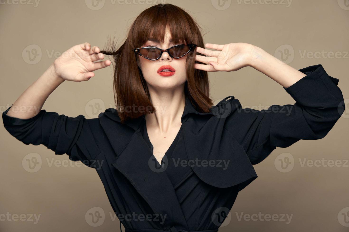 Charming brunette Fashionable clothes cropped look black coat photo