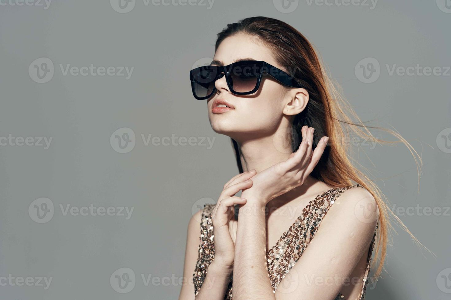 attractive woman wearing sunglasses golden dress decoration model studio photo