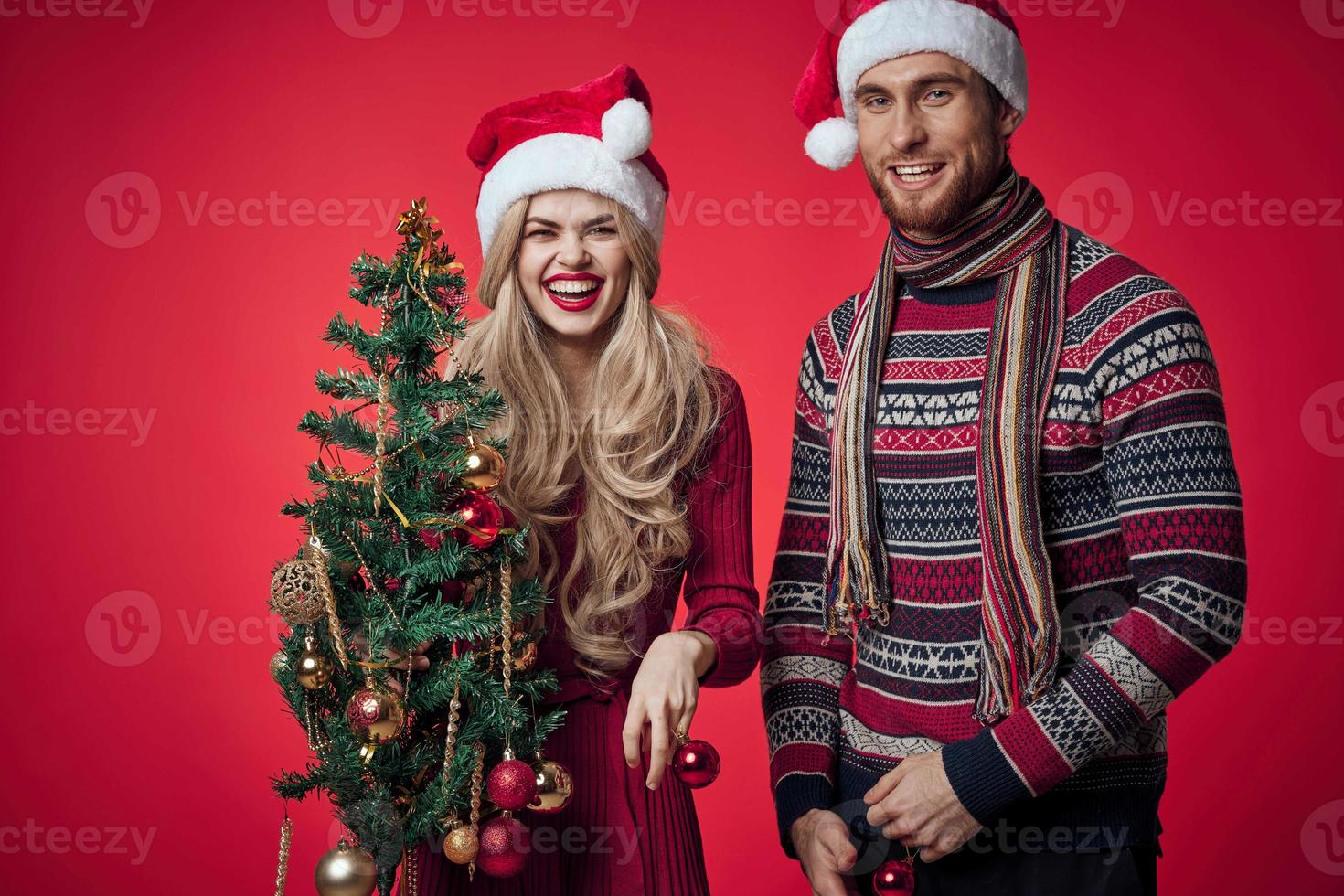 married couple emotions christmas holiday red background photo