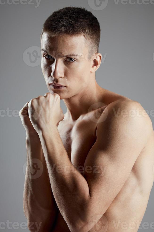 boxer with fist on gray background closeup portrait photo