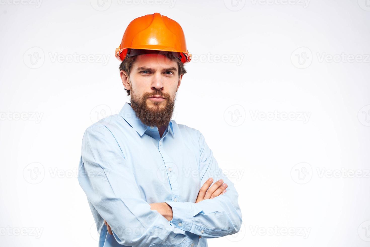 Worker man in orange paint engineer emotions industry construction photo