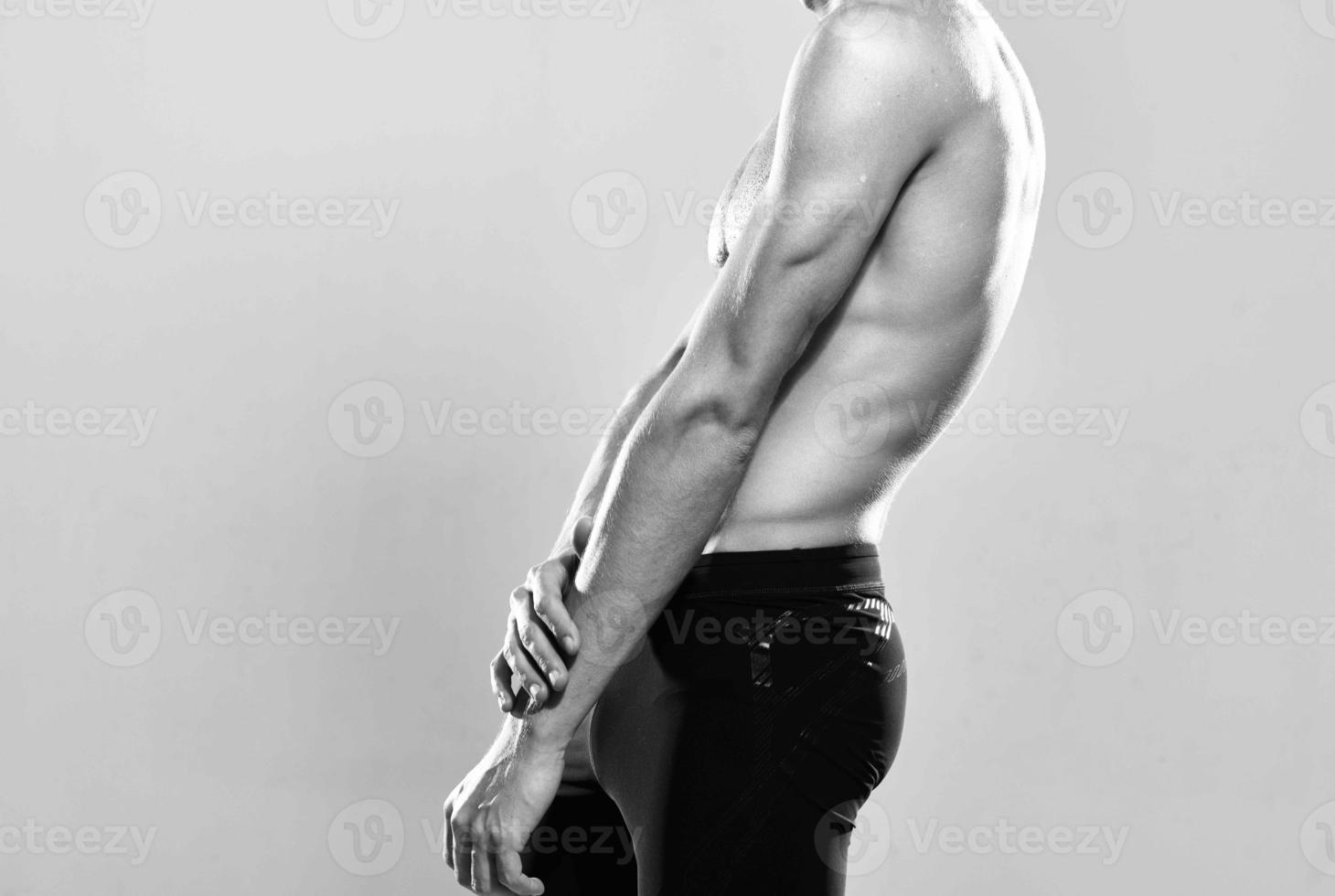 athletic man with muscular body strength exercise photo