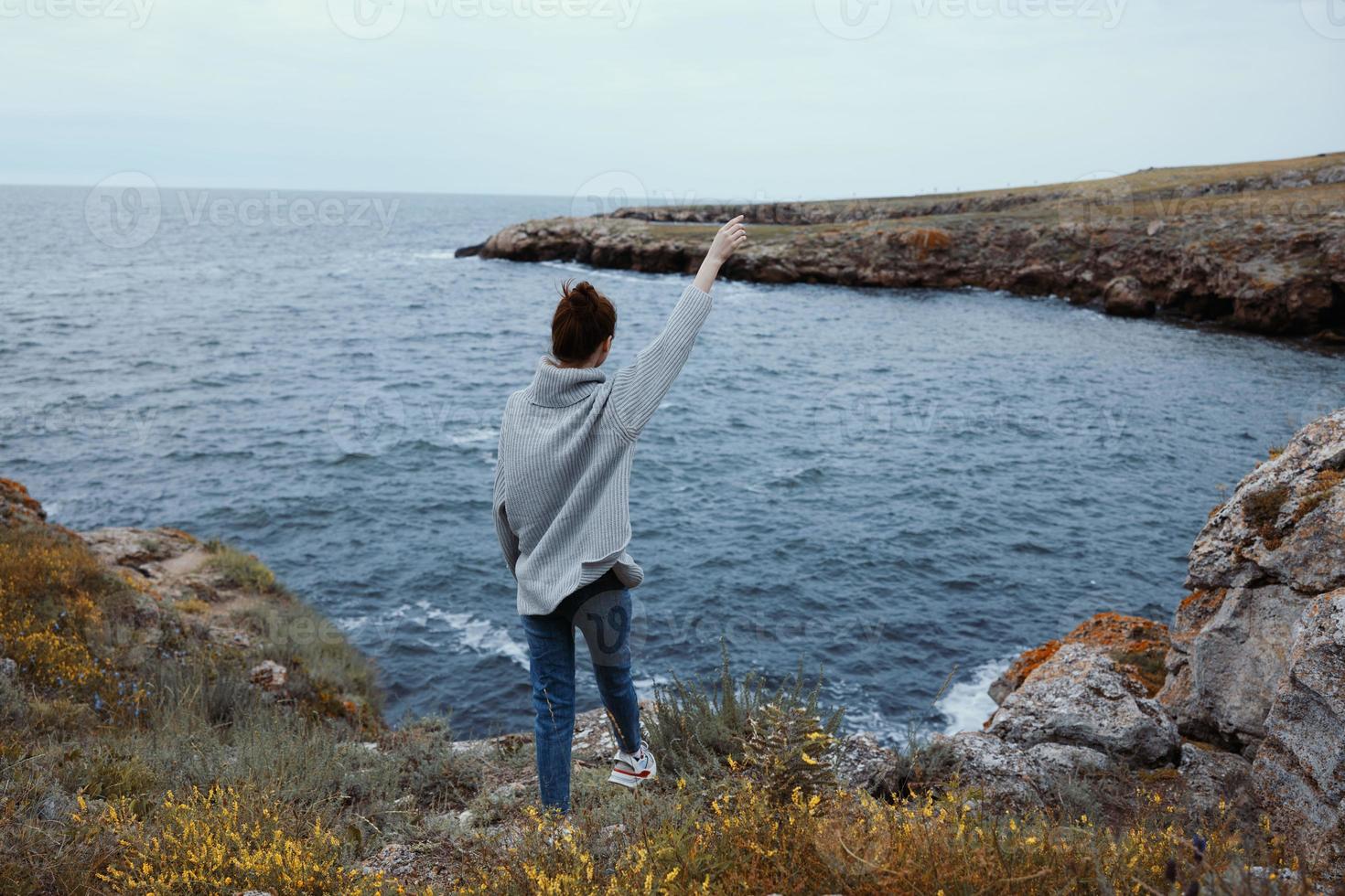 woman freedom walk on the stone coast unaltered photo