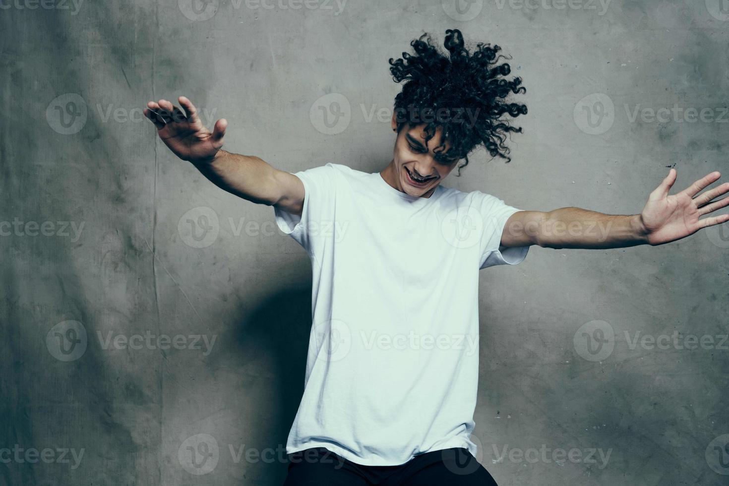 funny man in white t-shirt curly hair fashion photo