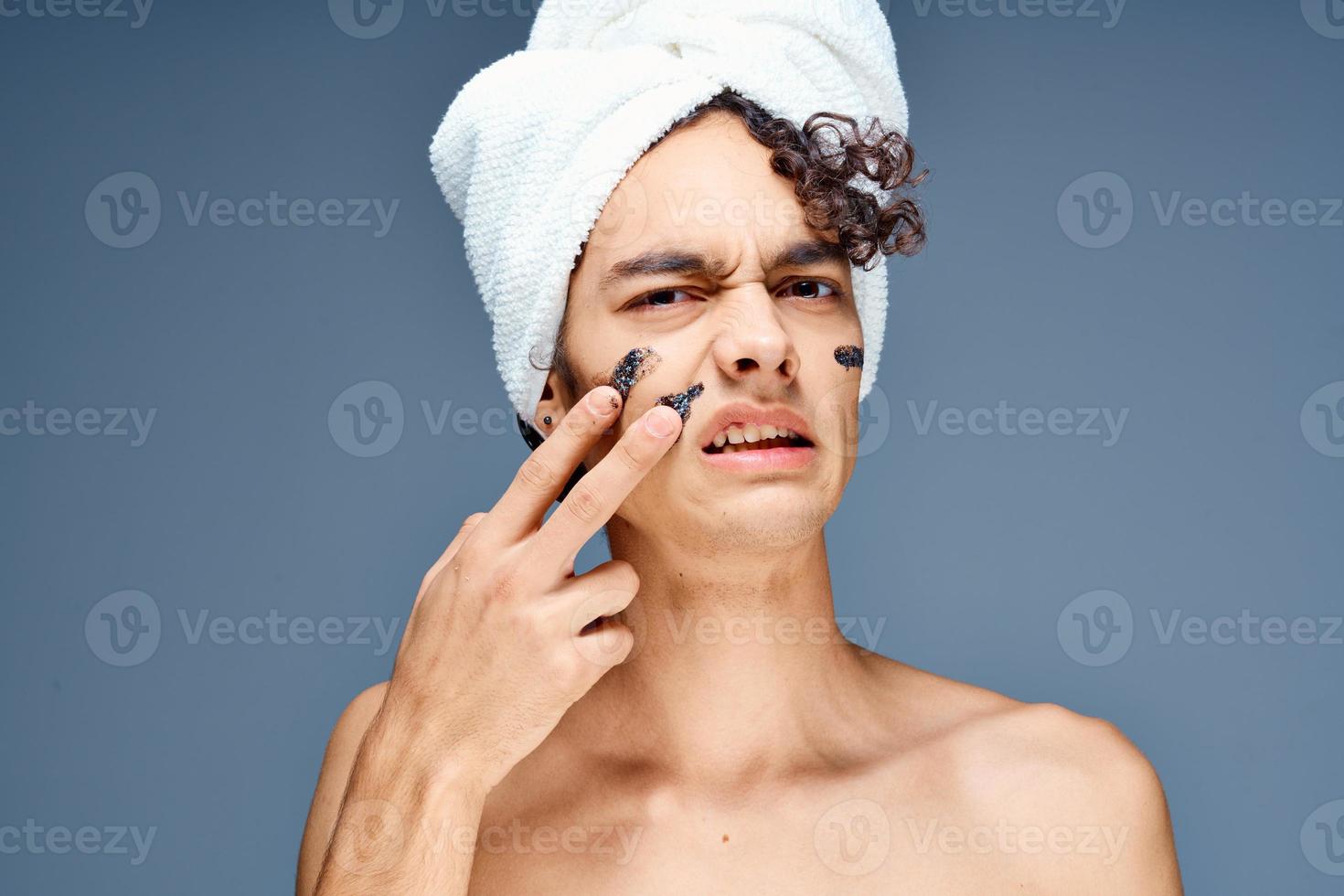 handsome guy with a towel on his head naked shoulders cosmetics clean skin photo