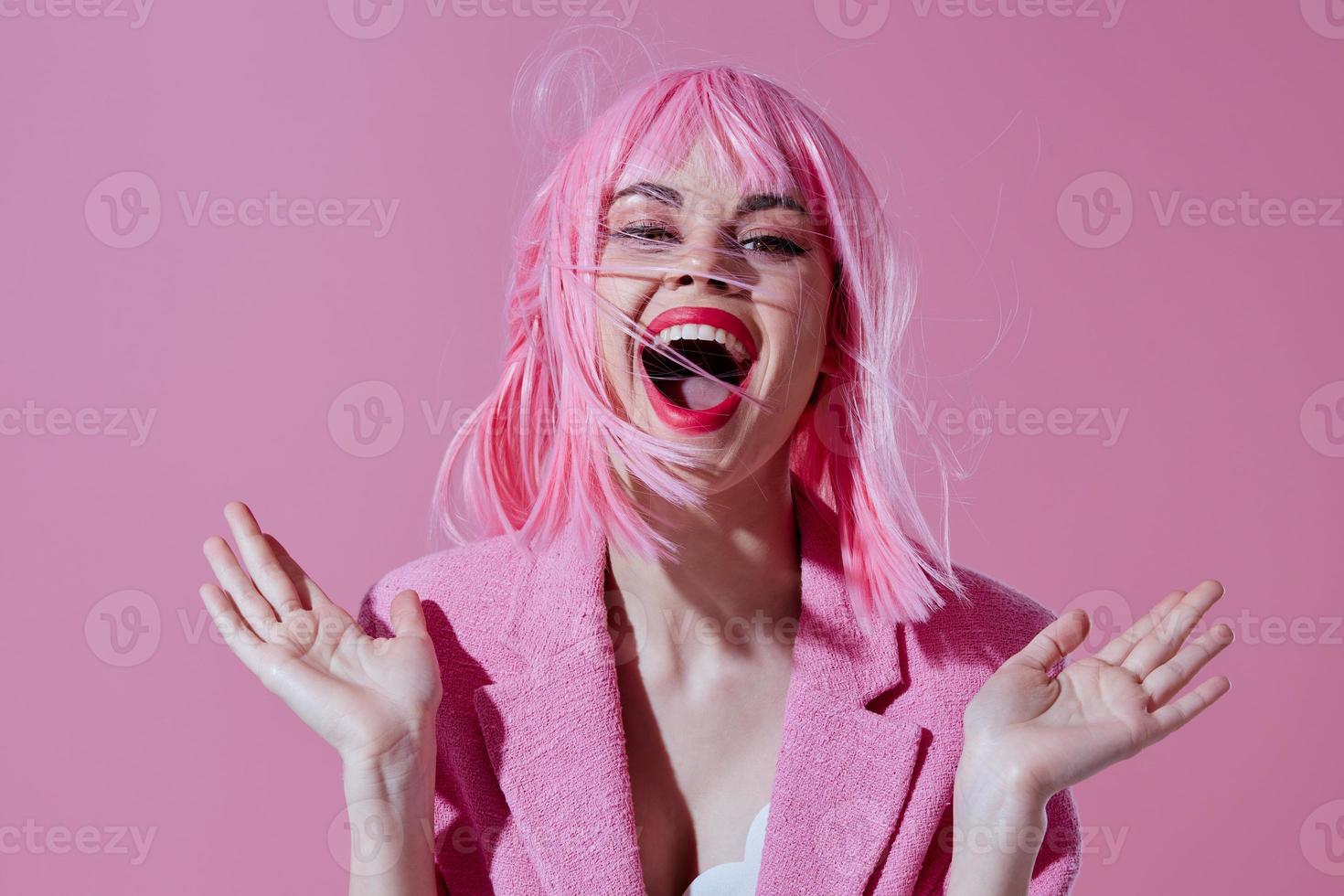 Pretty young female in a pink blazer pink wig cropped view color background unaltered photo