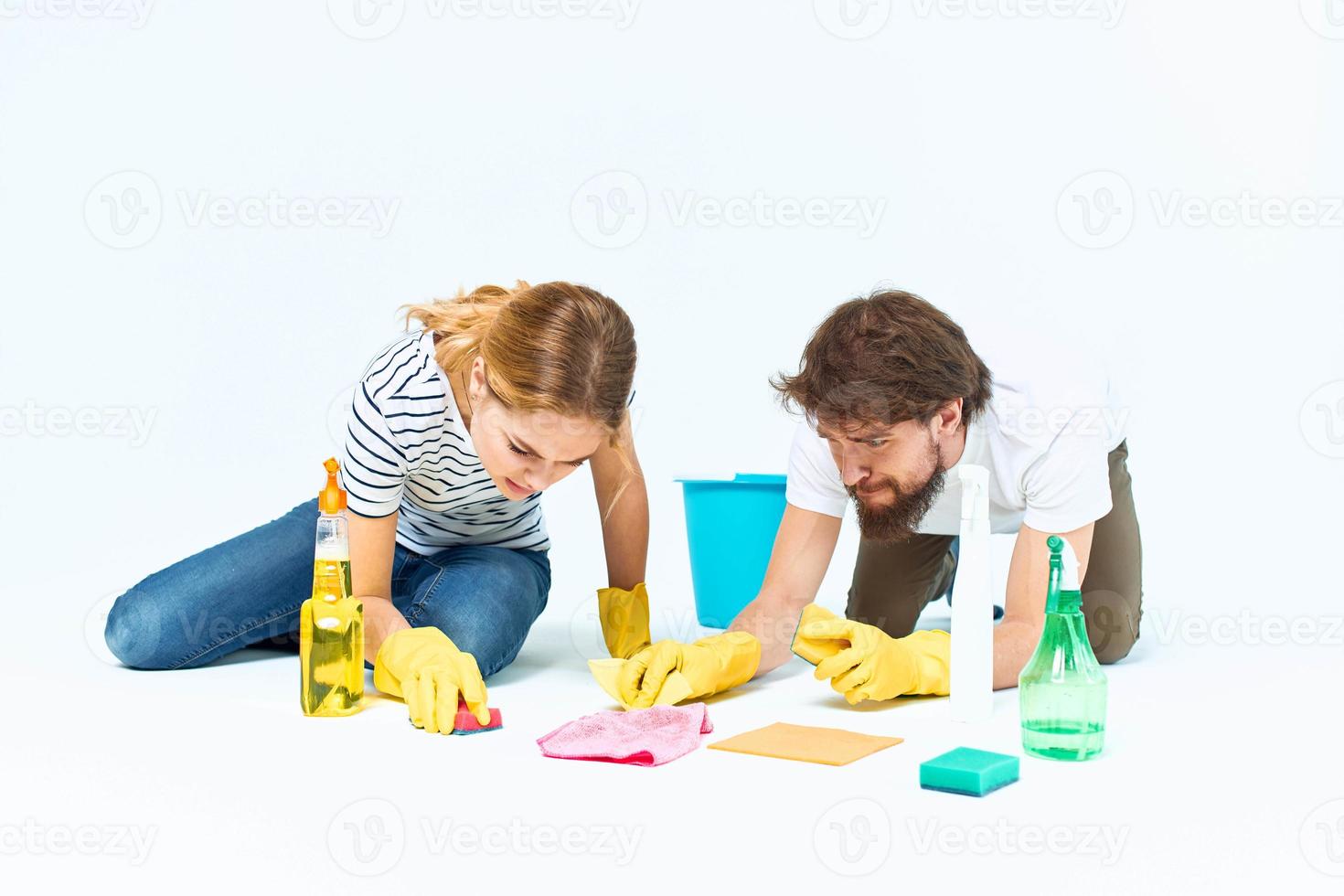 Young couple wash floors at home interior light background lifestyle photo