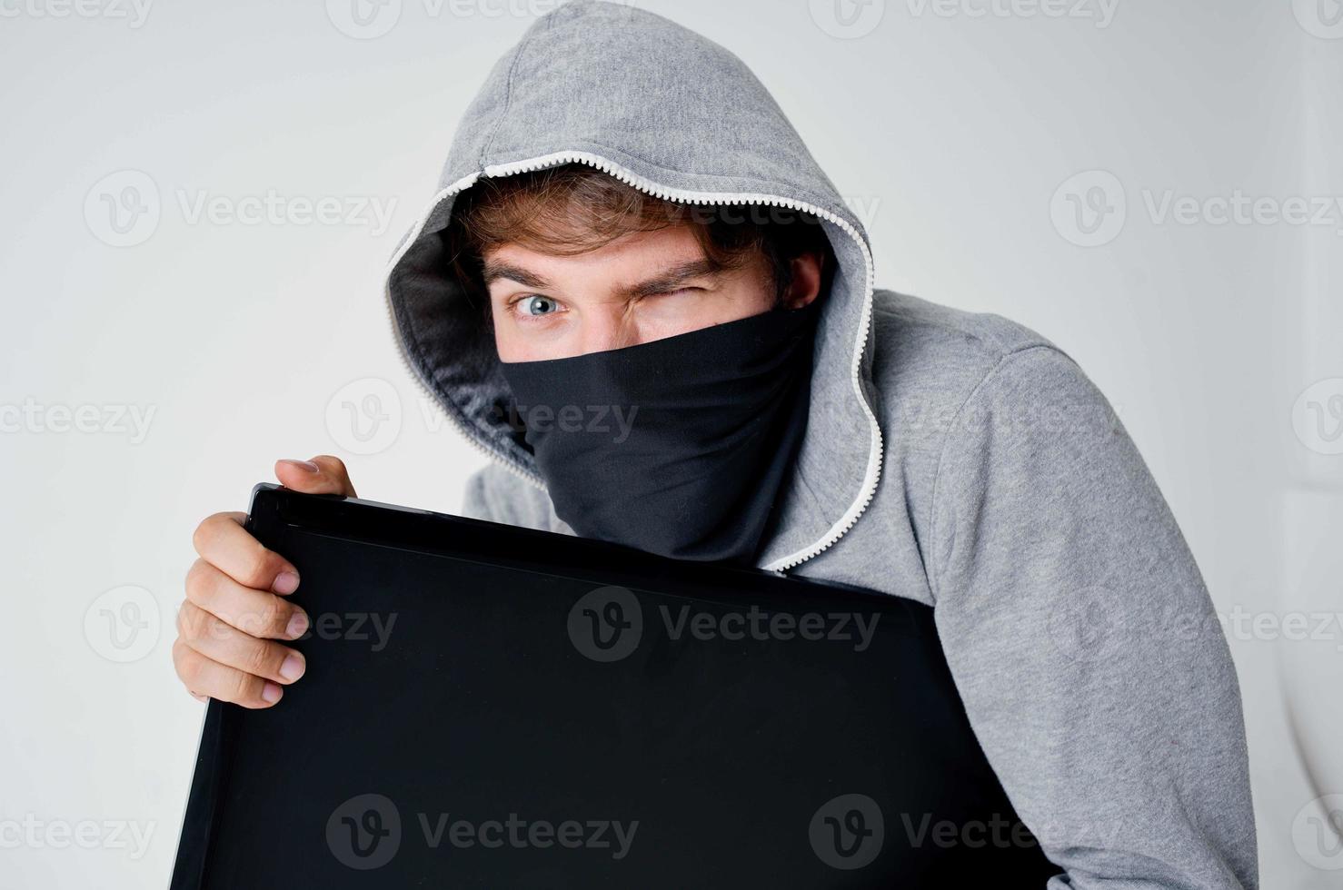 masked man hooded head hacking technology security light background photo