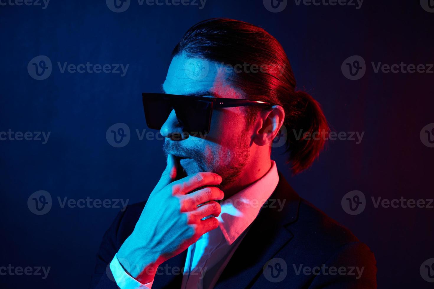 stylish man modern style suit fashion sunglasses neon light photo