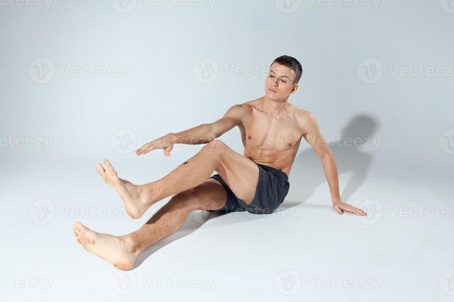 man doing exercise indoors sport fitness bodybuilding model photo