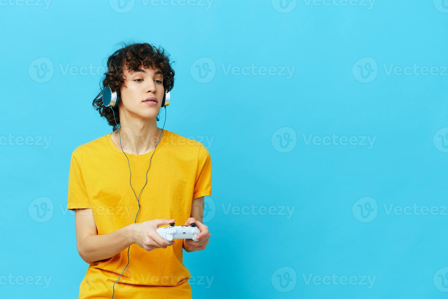 guy yellow T-shirt with joystick video games Lifestyle entertainment photo