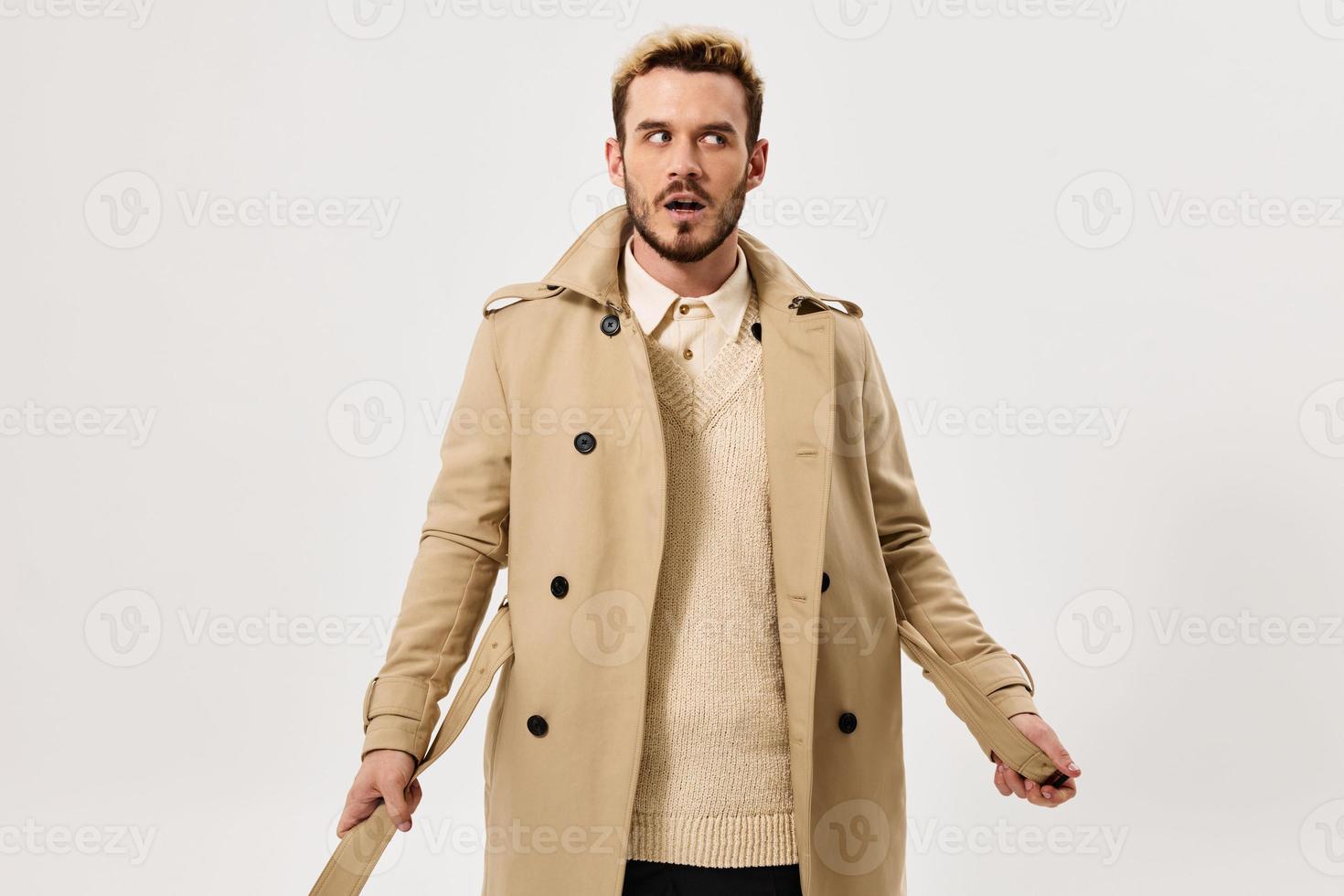 man beige coat autumn style studio side view isolated background photo