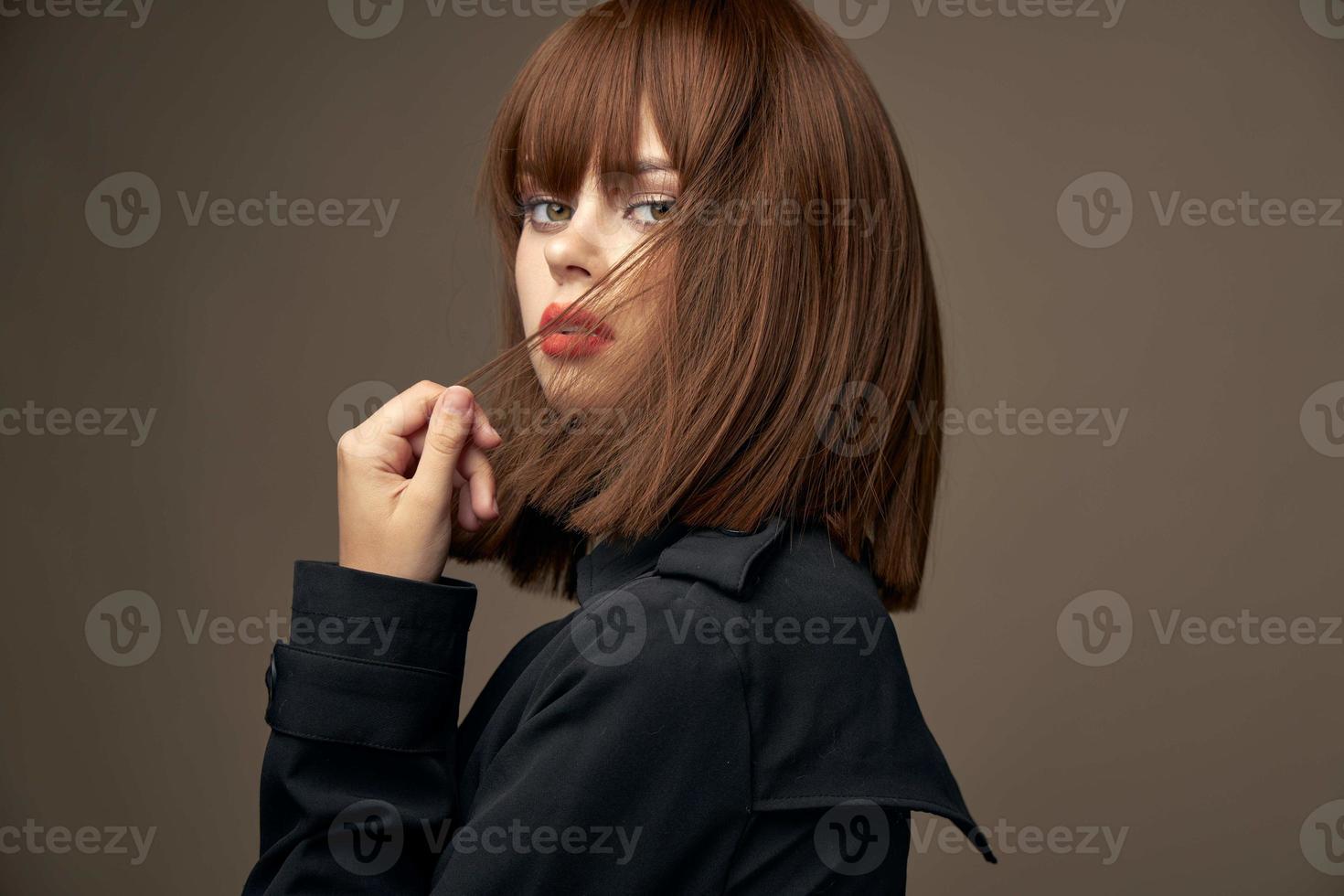 Charming lady European appearance black coat cropped view photo