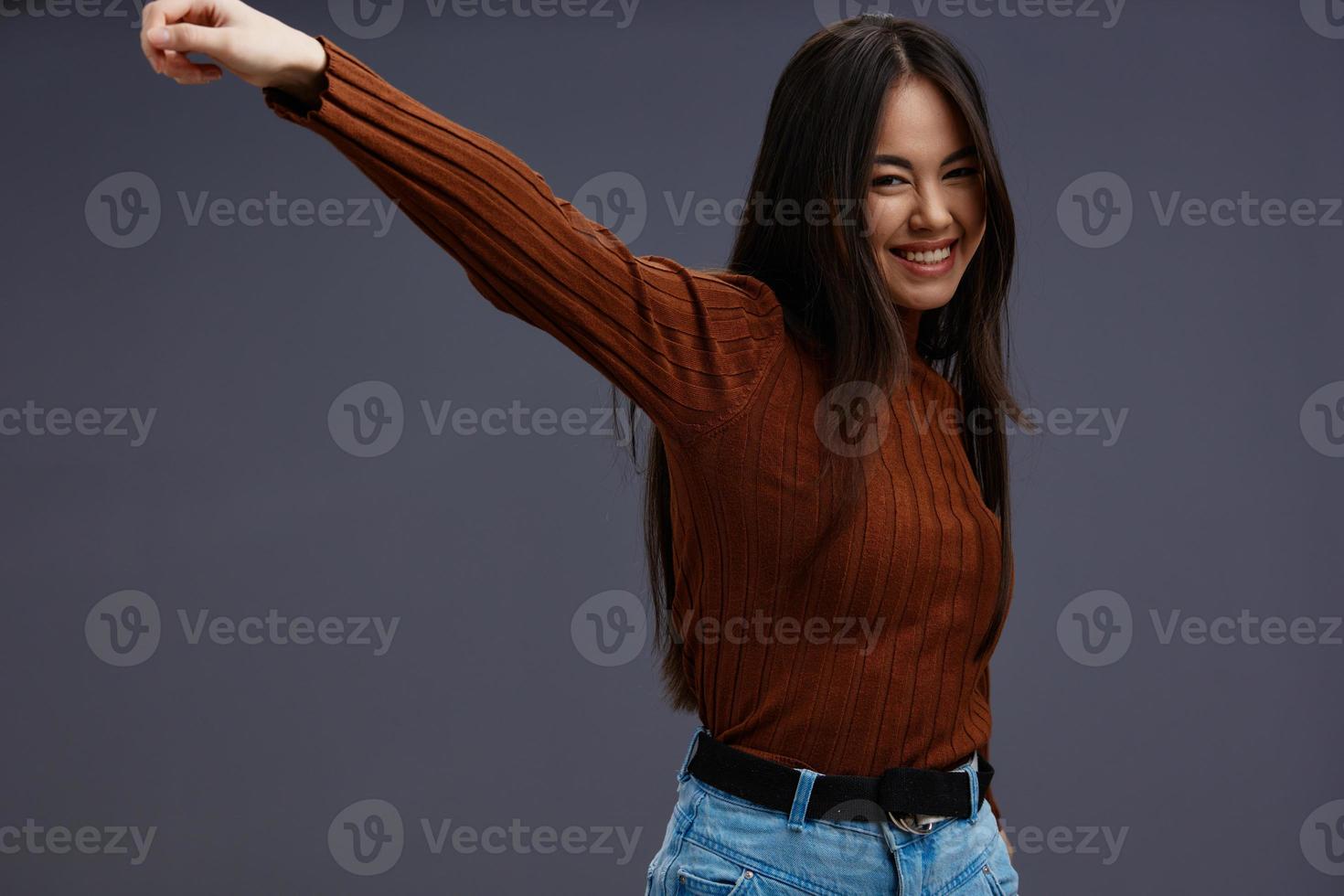 beautiful woman fun brown sweater posing casual wear isolated background photo