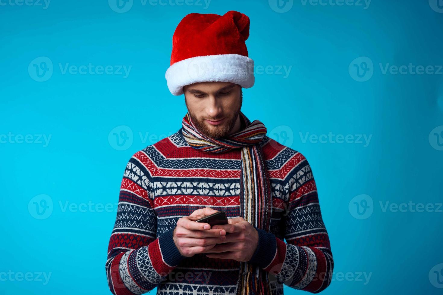 Cheerful man in New Year's clothes advertising copy space isolated background photo