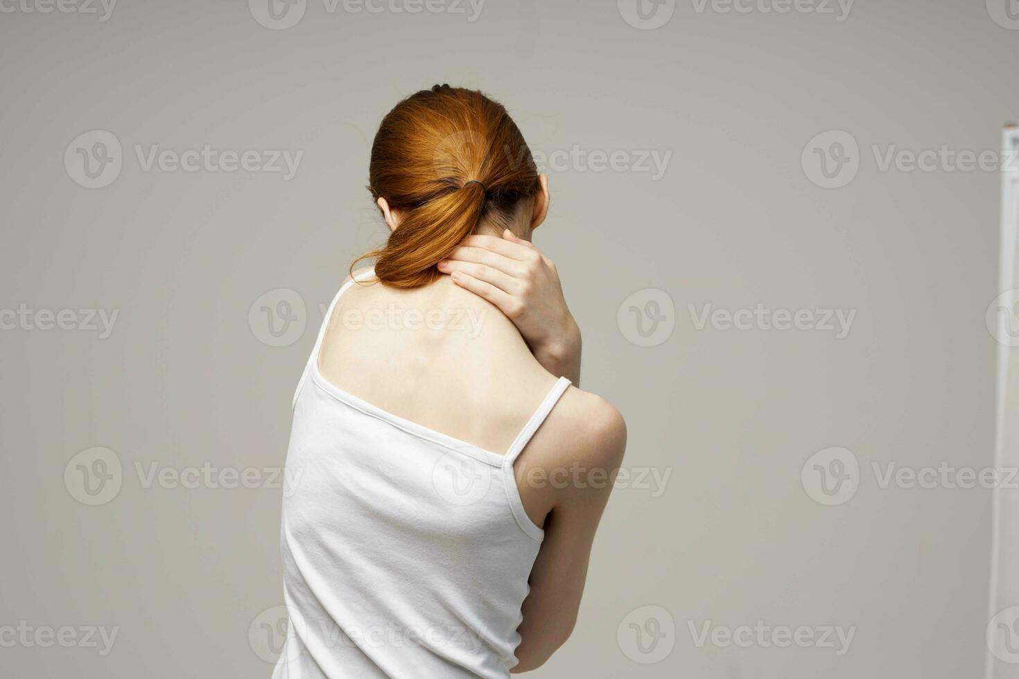 woman rheumatism pain in the neck health problems isolated background photo