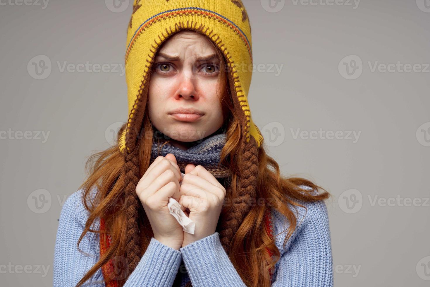 red-haired woman health problems temperature light background photo