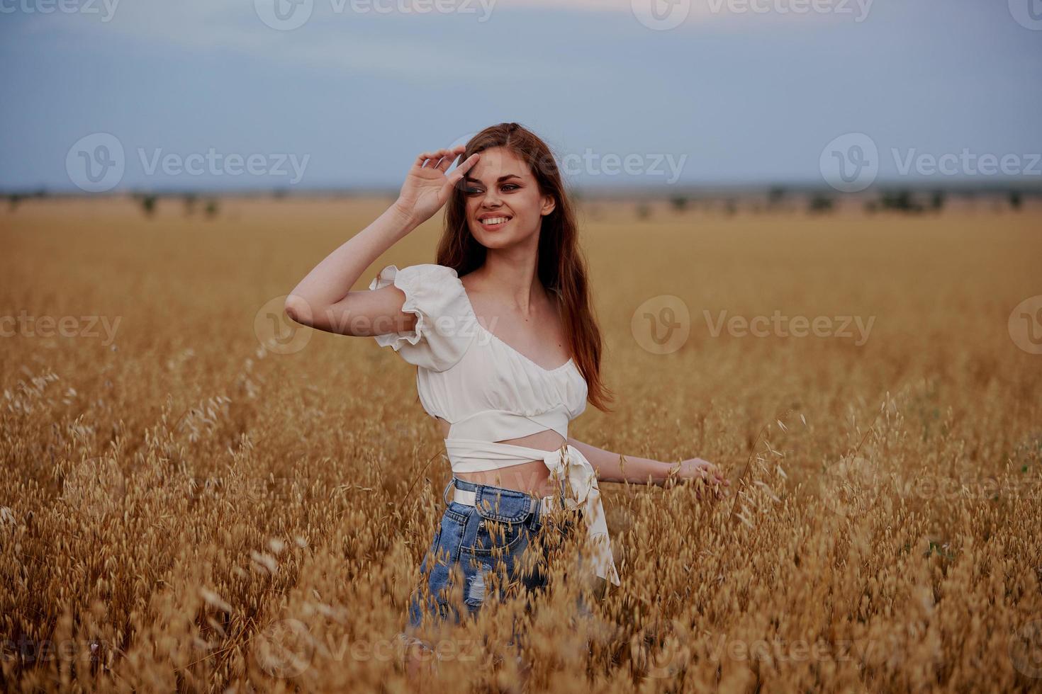 cheerful woman outdoors in the field freedom fun landscape photo