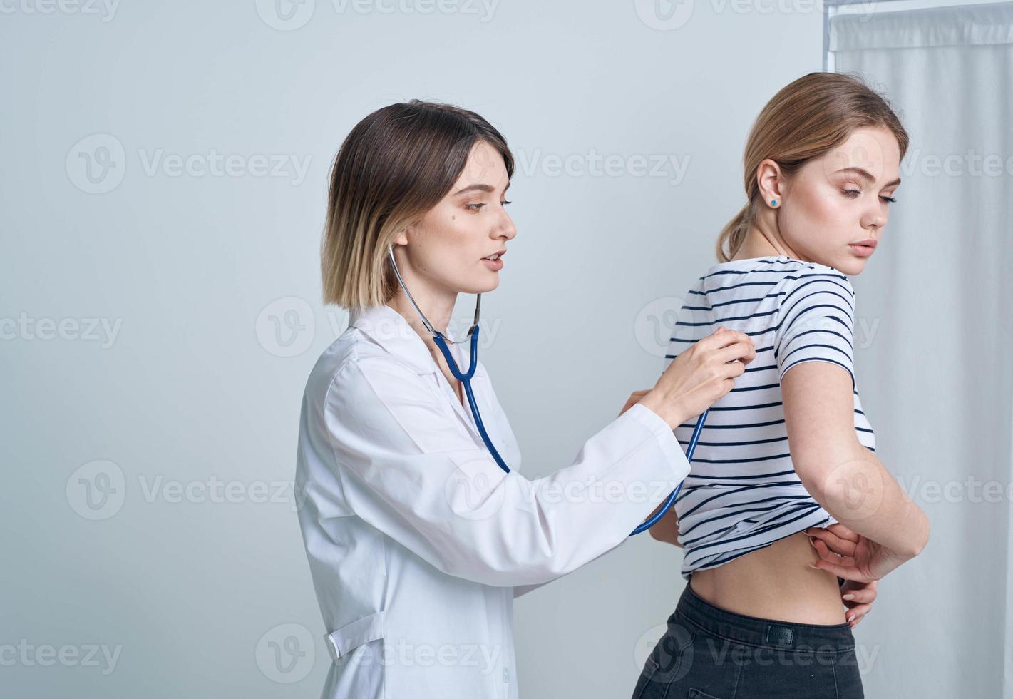 woman at the doctor's appointment medical gown stethoscope health photo