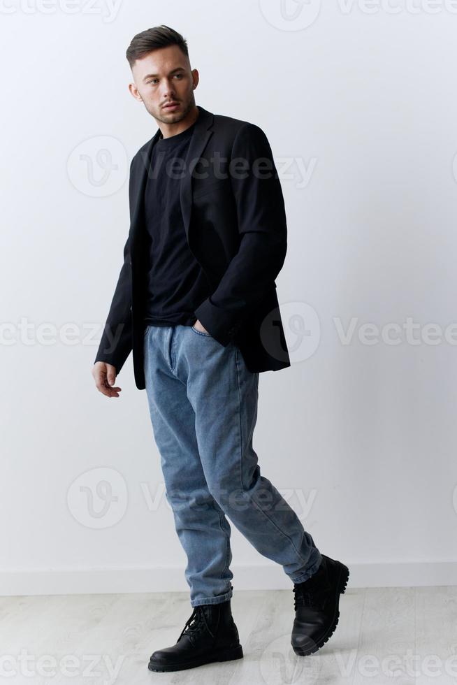Modelling snapshots. Serious narcissistic self-confident attractive handsome man in classic suit jacket posing isolated in white studio background. Fashion offer. Copy space for ad. Full body shot photo