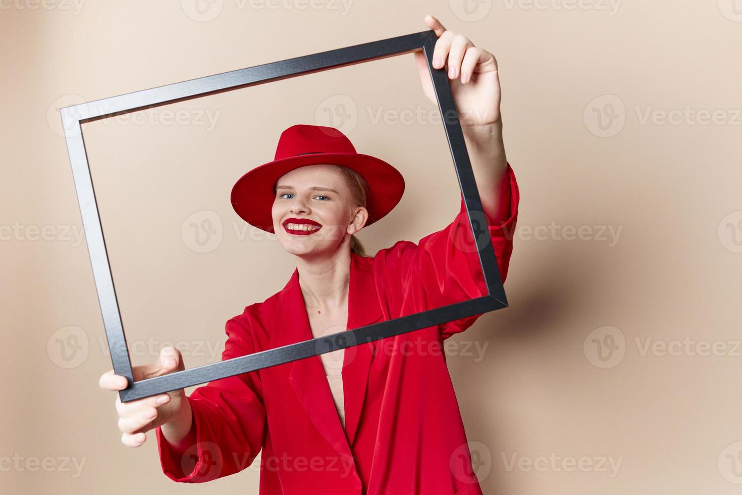 woman with wooden frame posing red suit Lifestyle posing photo