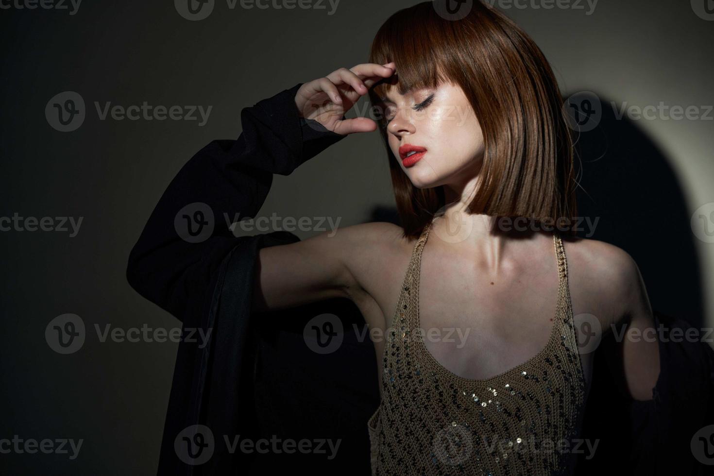 wear charming woman coat dark room cropped view photo