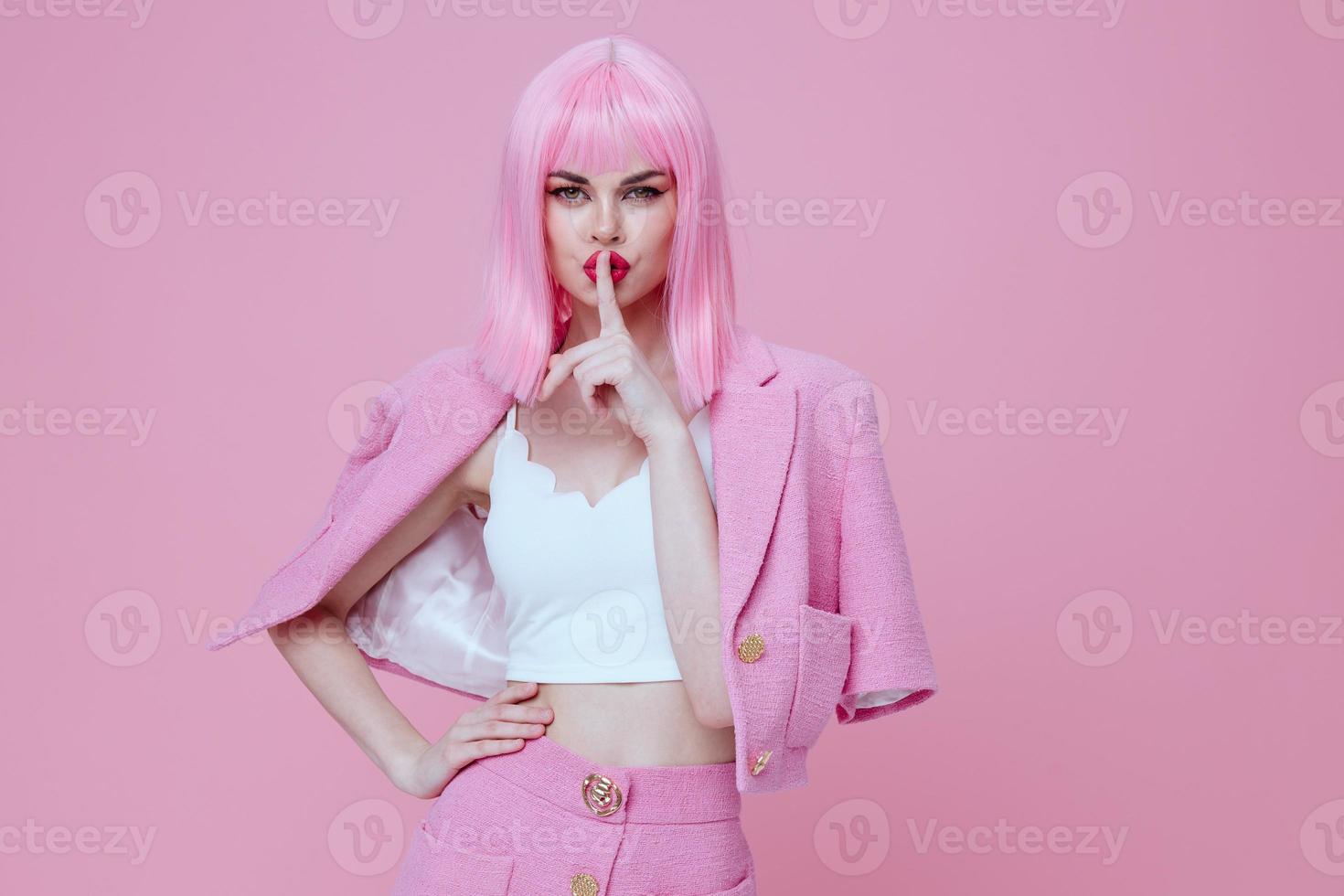 Beauty Fashion woman in a pink suit gesturing with his hands emotions fun color background unaltered photo