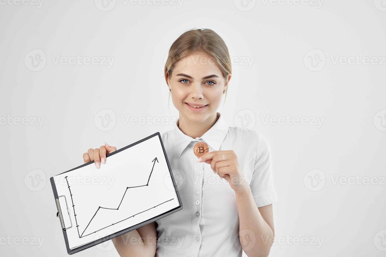 cheerful woman in a white shirt with a folder in hand technologies photo
