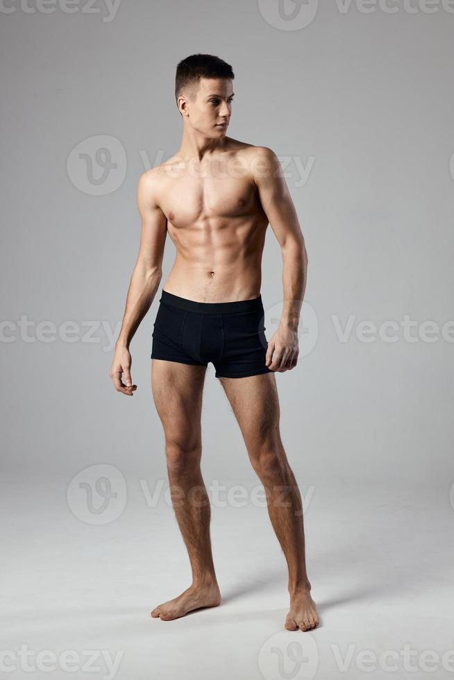 strong athlete in black panties muscled torso photo