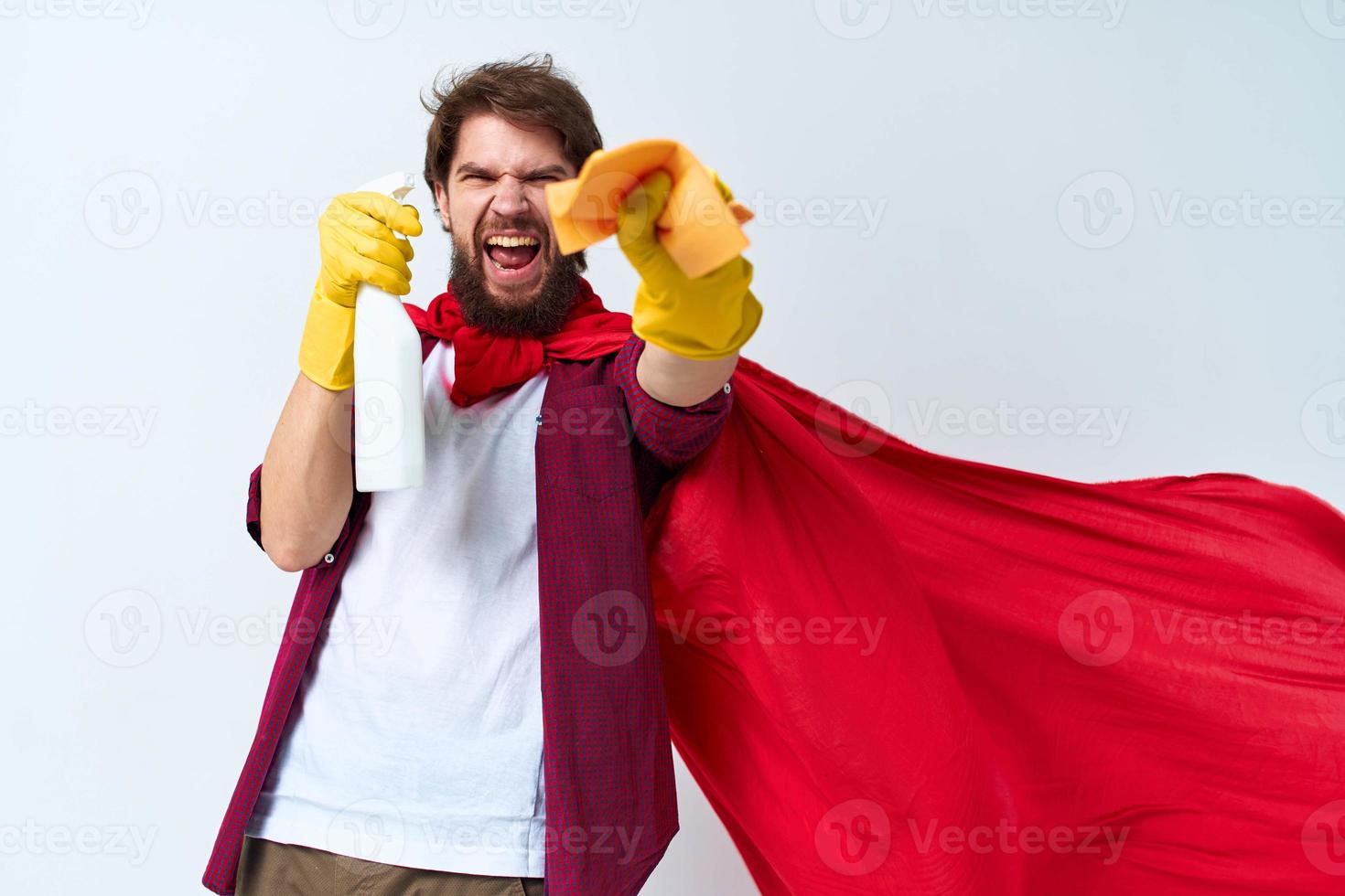 Emotional man in red raincoat detergent house cleaning service light background photo