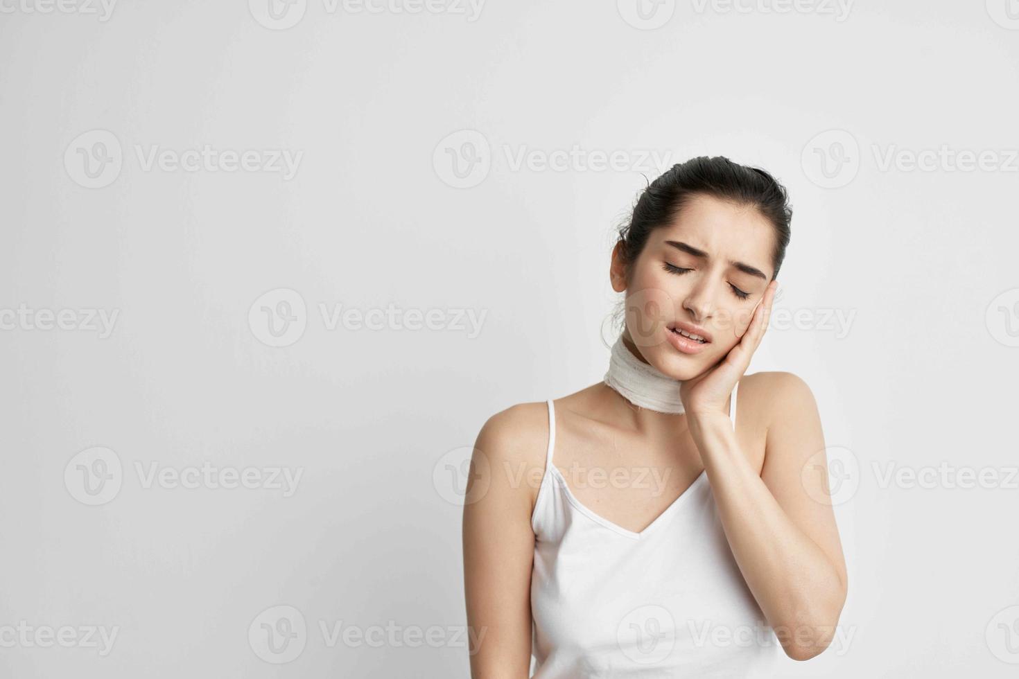 brunette bandaged neck negative headache isolated background photo