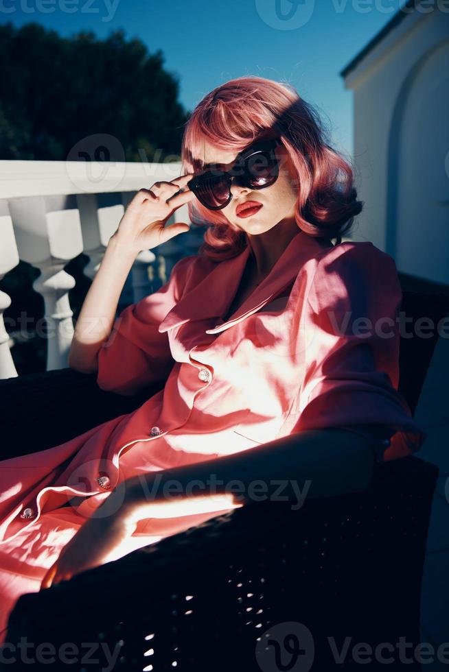 glamorous woman pink hair sunglasses leisure luxury vintage sunny day photo