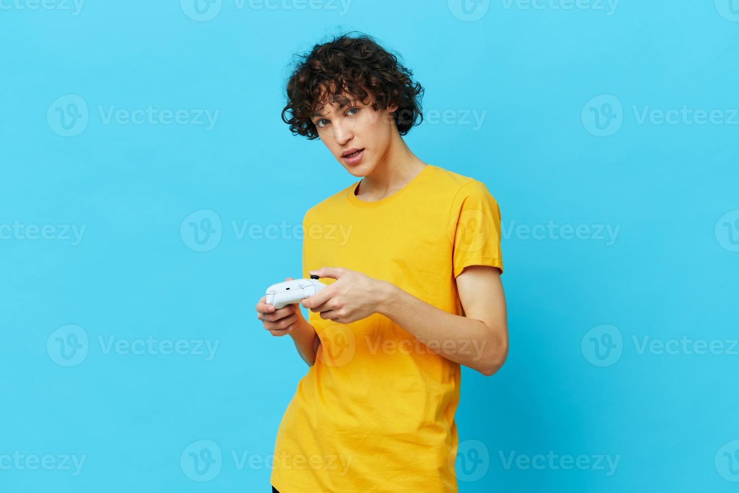 man yellow T-shirt with joystick video games technologies photo