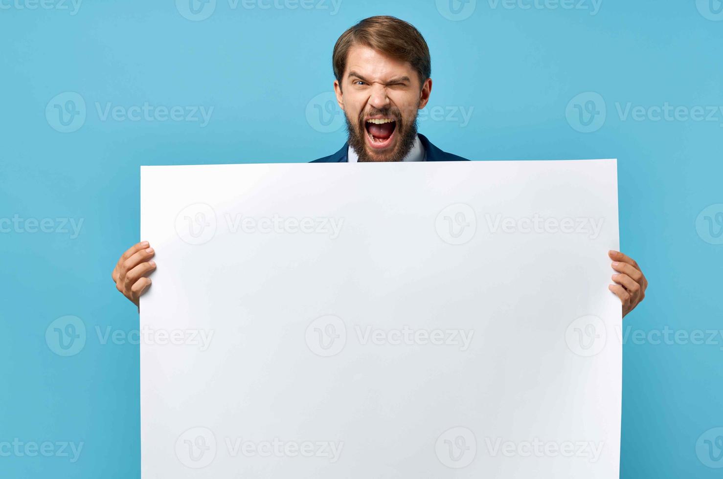 man with white poster advertising copy space blue background photo