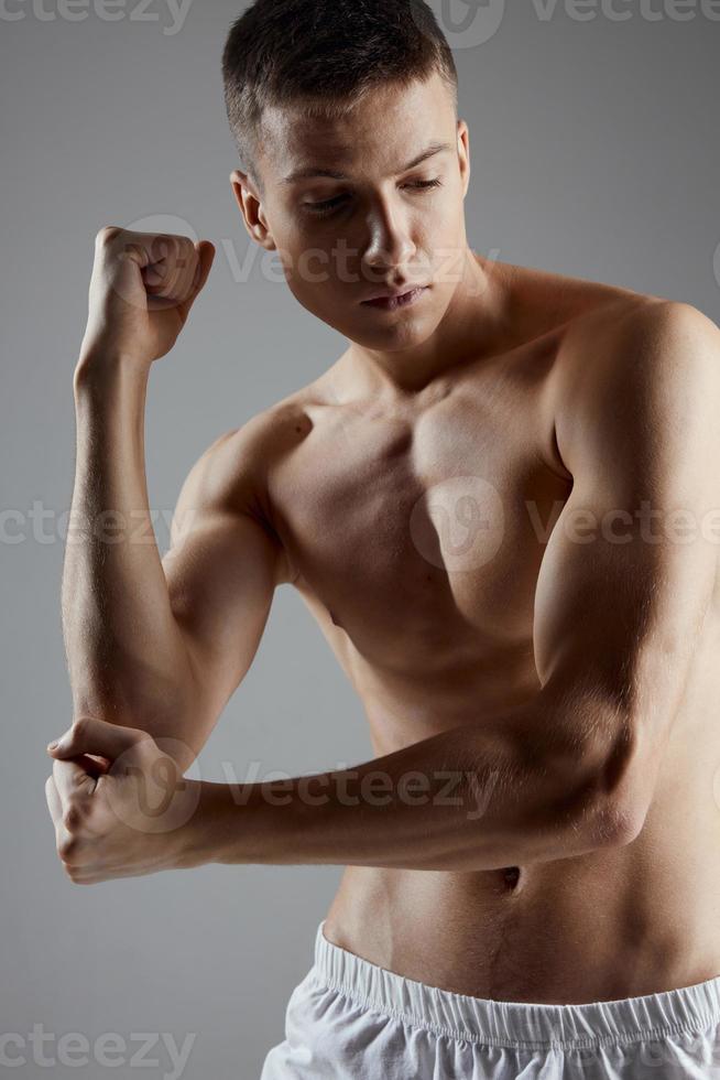 athlete clenched his hand into a fist workout gym close-up photo
