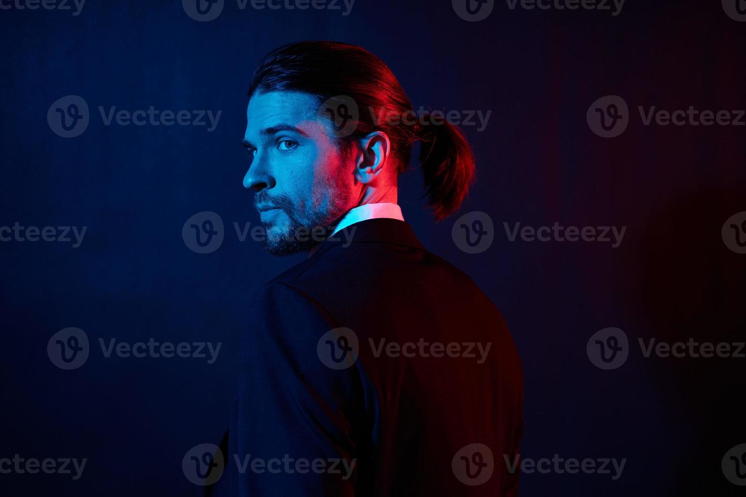 businessmen gestures with his hands attractive look neon light photo