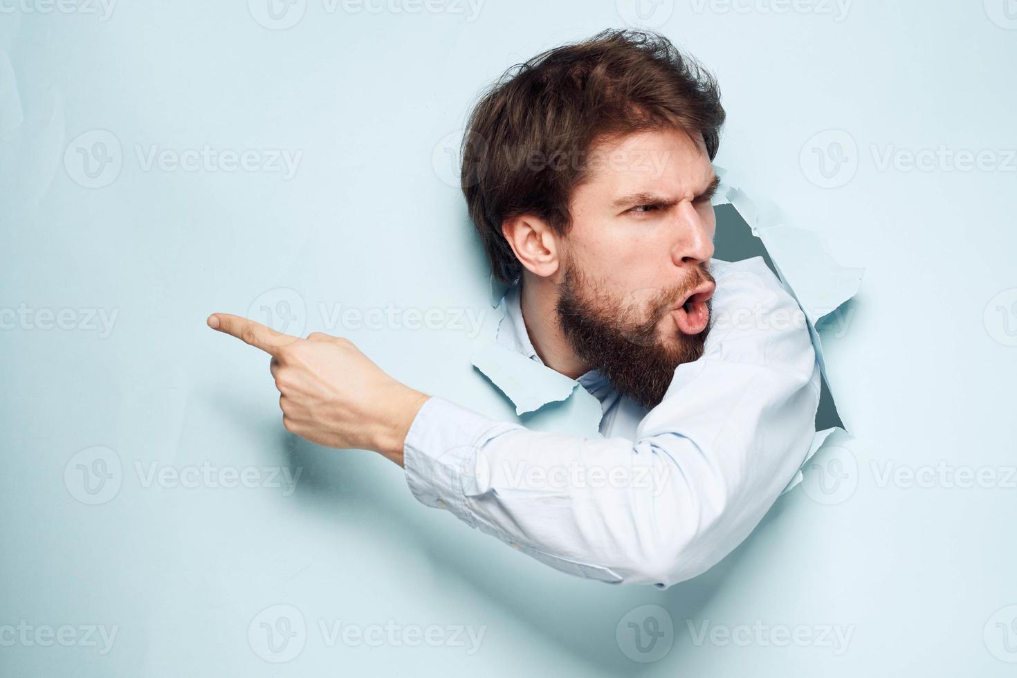 Angry man gestures with his hands dissatisfaction emotions work office photo