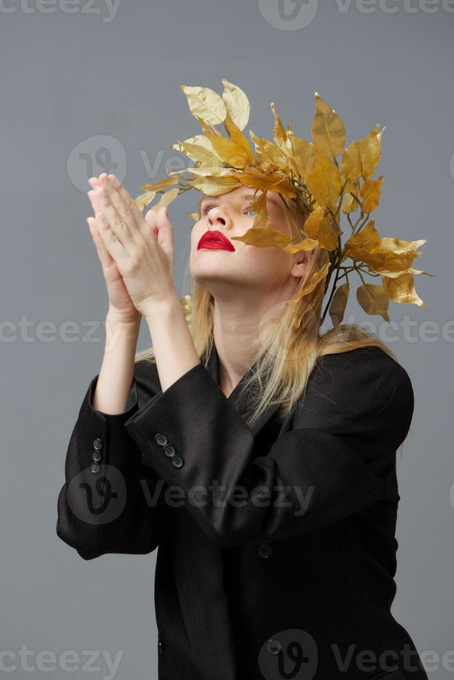 fashionable woman golden leaves wreath black blazer red lips studio model unaltered photo