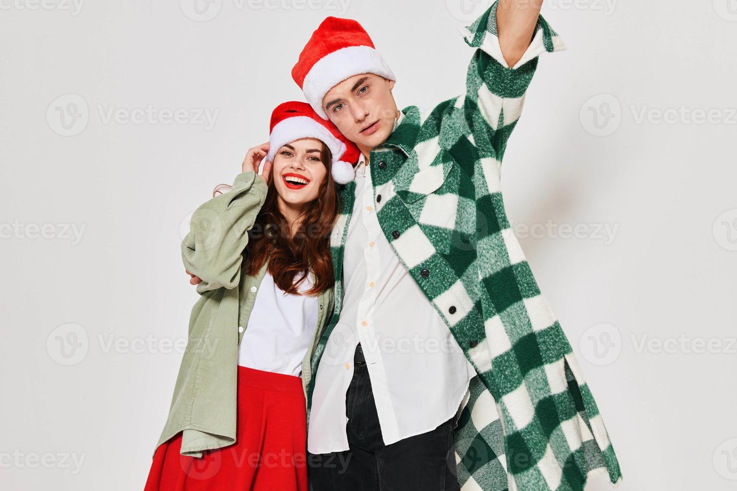 young fashionable couple new year holiday hug studio fun photo