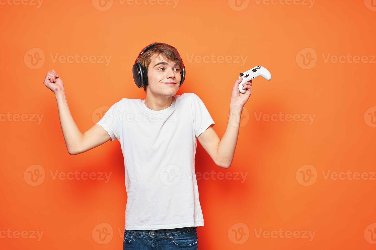 guy in a white t-shirt with a joystick in his hands entertainment games technology photo