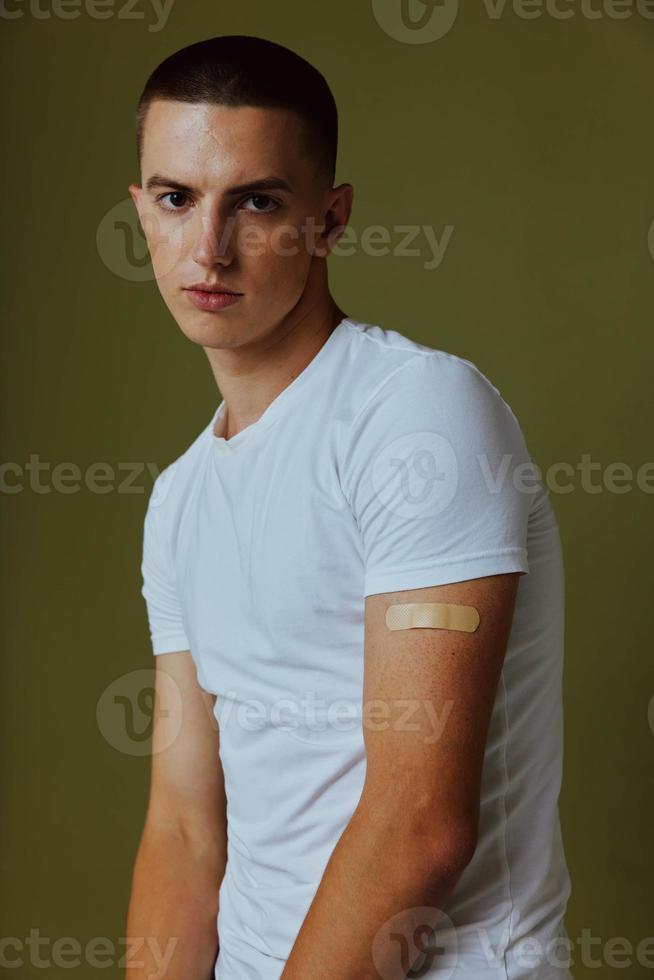 guy with a plaster on his hand immunity protection vaccine passport photo