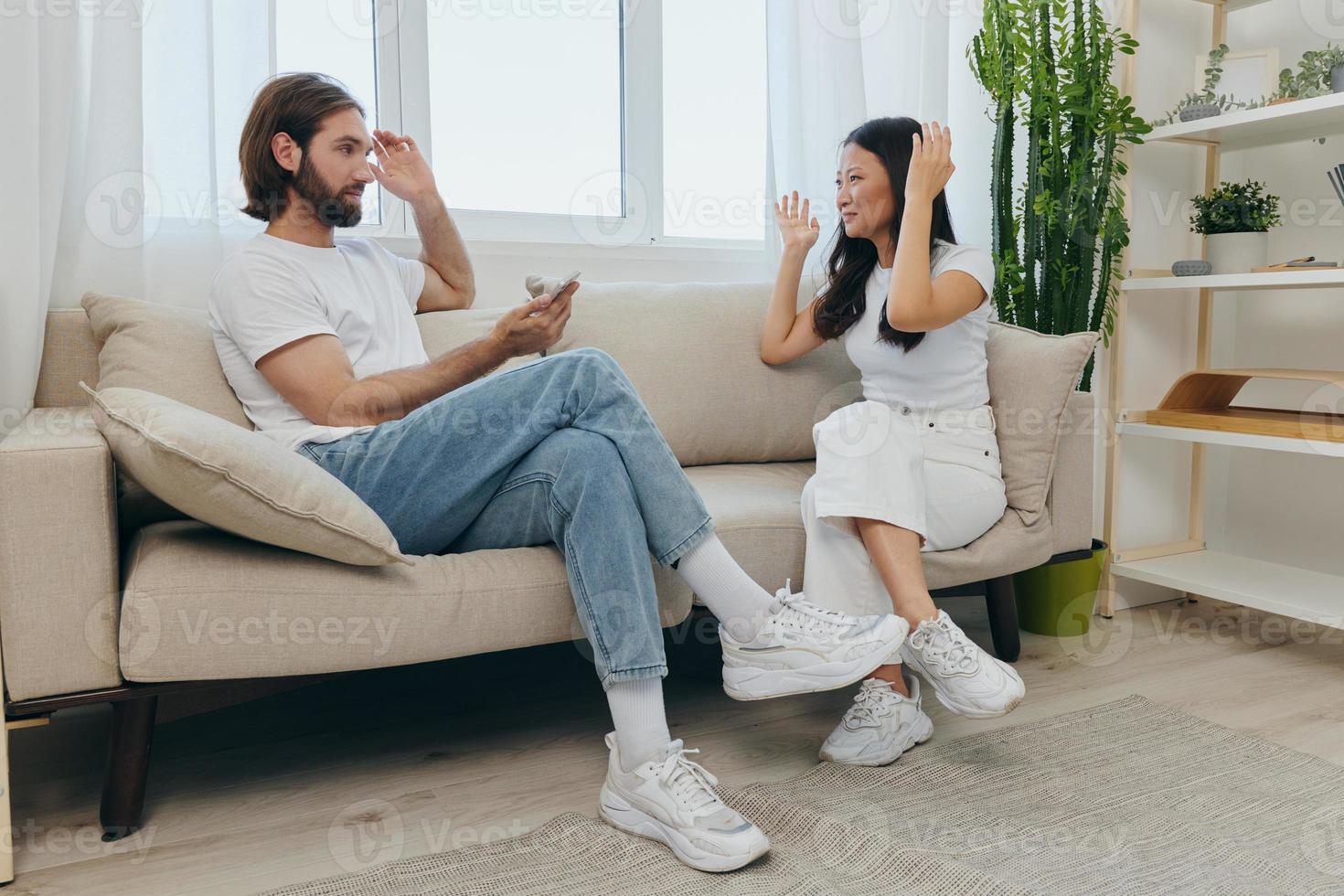 Young couple husband and wife fight and yell at each other because of disagreements in the family, psycho emotional unstable state in the family, couple's divorce photo