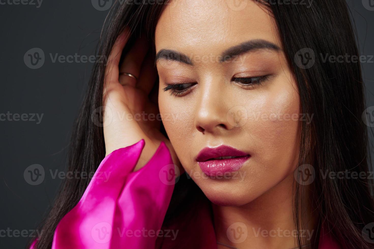 young woman in pink dress fashion makeup glamor isolated background photo