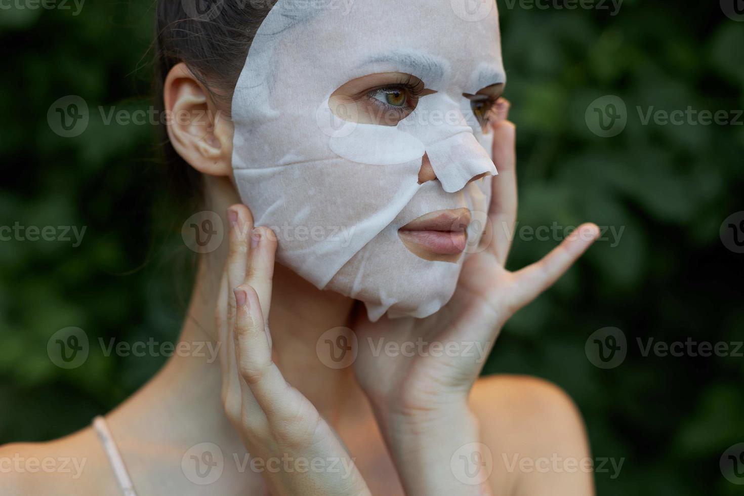 Nice woman Anti-wrinkle mask Touch your neck with your hands skin care photo